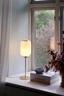   
                        Настільна лампа NORDLUX (Данія) 51264    
                         у стилі Модерн.  
                        Тип джерела світла: світлодіодна лампа, змінна.                                                 Кольори плафонів і підвісок: Білий.                         Матеріал: Скло.                          фото 3
