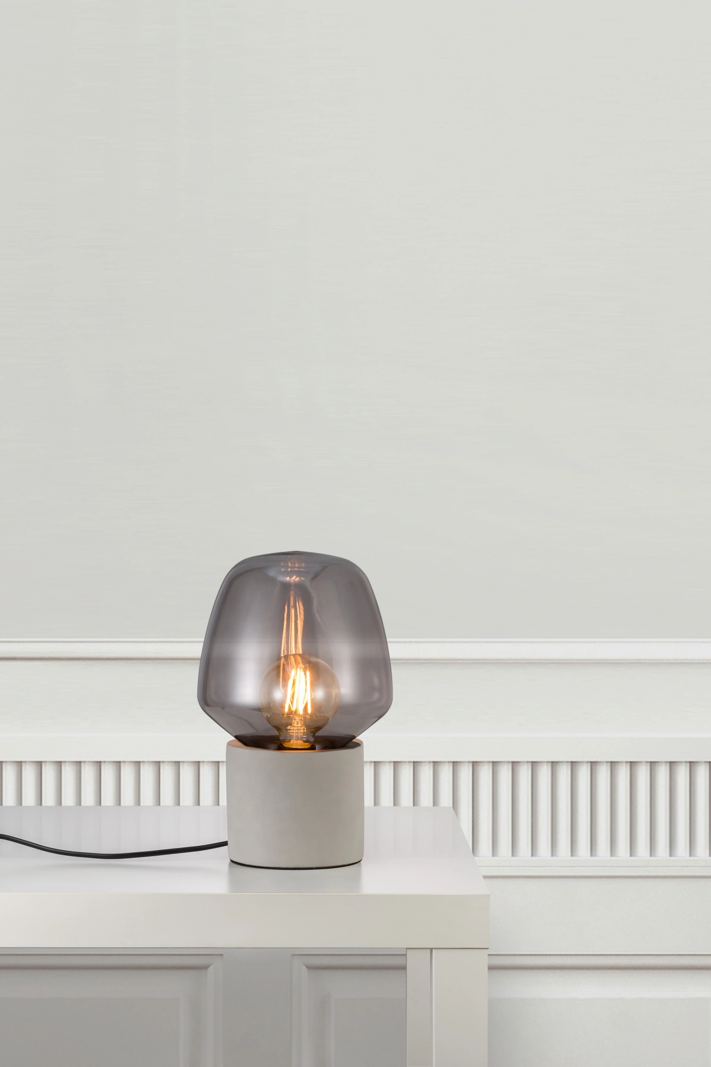   
                        
                        Настольная лампа NORDLUX (Дания) 52487    
                         в стиле Лофт, Модерн.  
                        Тип источника света: светодиодная лампа, сменная.                                                 Цвета плафонов и подвесок: Серый.                         Материал: Стекло.                          фото 2